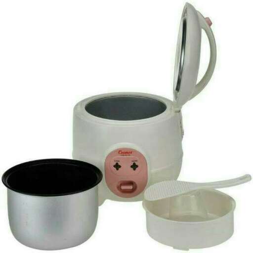 a white mug with a pink face on it.