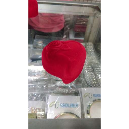 a red hat in a glass case.