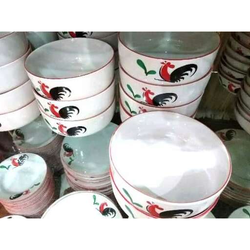 a collection of colorful cups and bowls.