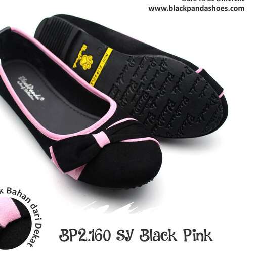 a pair of black slippers with pink trim.