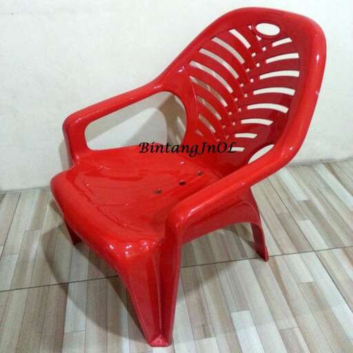 a red chair by person