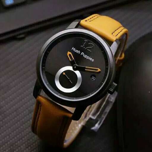 a watch with a yellow face and a black strap.
