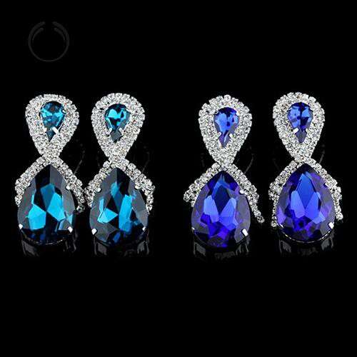 a pair of diamond and sapphire earrings