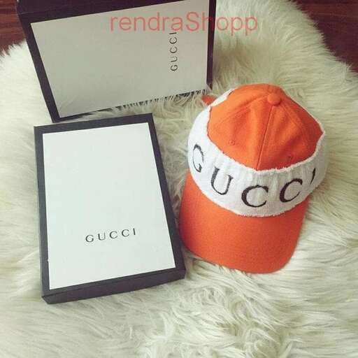 a hat and a card on a white furry rug.