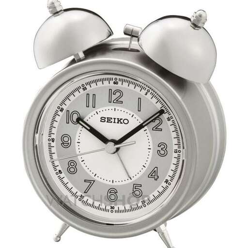 a silver alarm clock on a white background