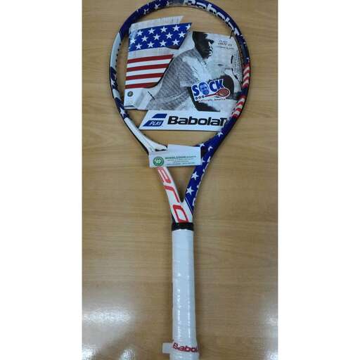 a tennis racket with a picture of a man on it.