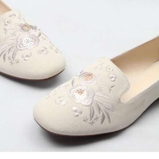 a pair of shoes with flowers