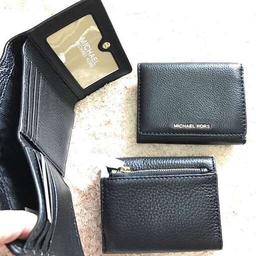 the wallet is made from a leather case.