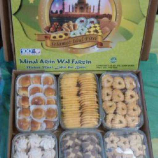 a box of doughnuts with a picture of a city in the background.