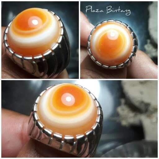 a ring made of a single strand of orange sea glass.