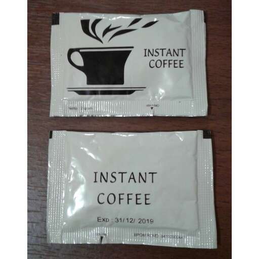 a couple of bags of coffee on a table.