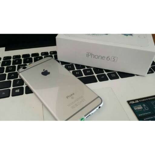 a white box and a phone on a desk.