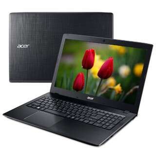 laptop computer with tulips in the background