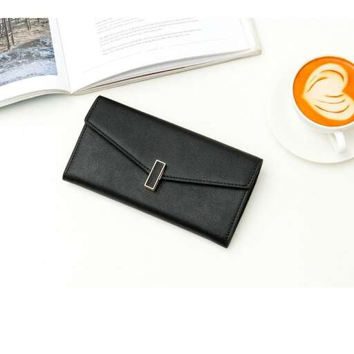 a black wallet sitting on top of a white table.