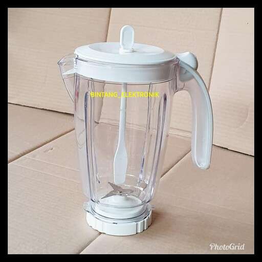 a white and black blender sitting on a wooden surface.