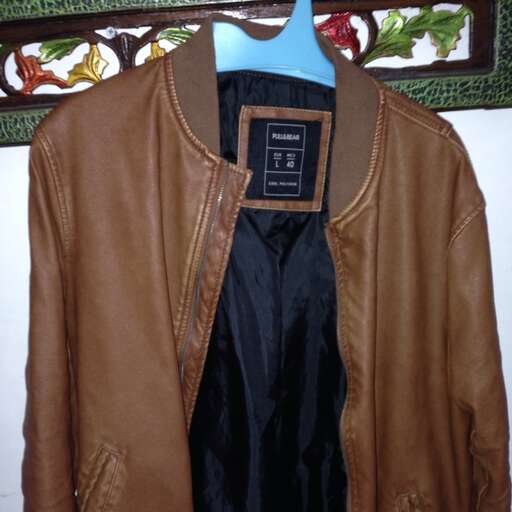 leather jacket with a blue collar