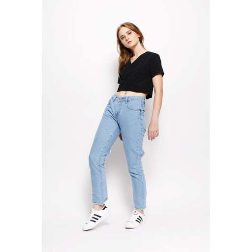 a model in a black t - shirt and jeans