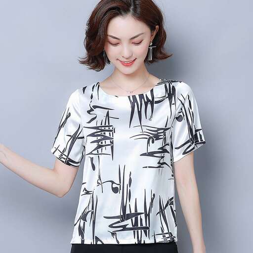 women's white top with black and white print in the front