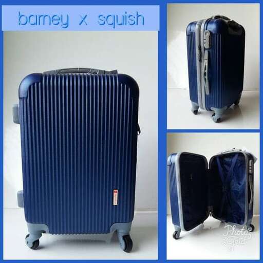 a blue suitcase with a black handle and wheels.