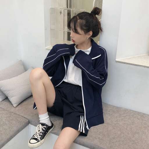 a girl sitting on a step in a room.