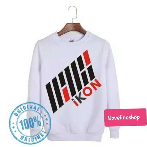 a white long sleeved t - shirt with a black and red print on the front.
