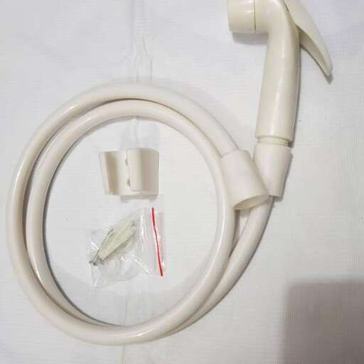 a white plastic handle with a white plastic bag inside.