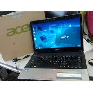 a laptop computer sitting on top of a desk.