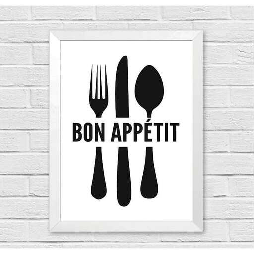 black and white poster with a fork and knife on a white brick wall
