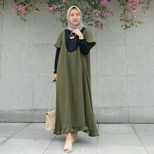 a woman in a green dress