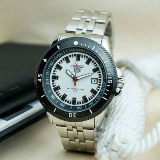a watch with a white rope and a black case