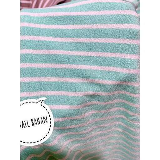 a striped blanket in pink and blue