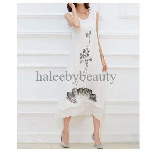 a long sleeved white dress with a bird on the back