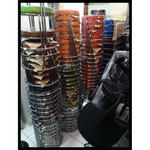 a rack of metal rack holding a guitar and a guitar.