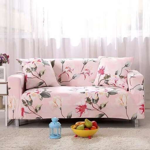 a couch with a bowl of fruit on it