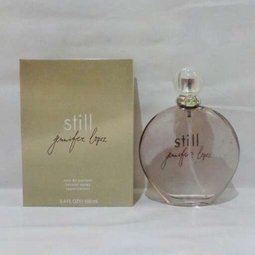 perfume bottle in gold and white