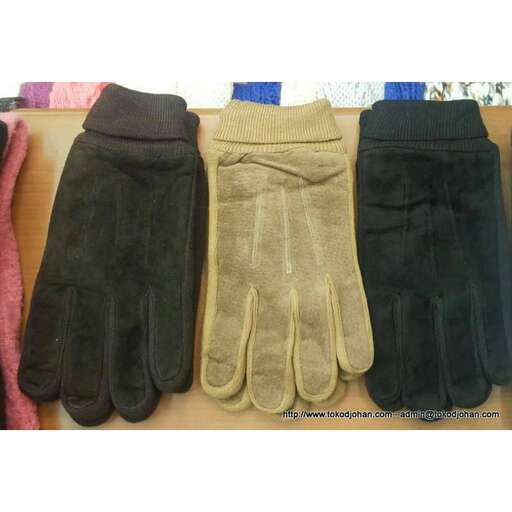 a set of black gloves with a long strip of fabric.