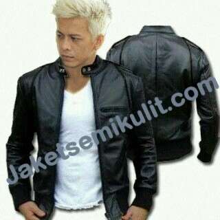 a man in a black leather jacket and white shirt