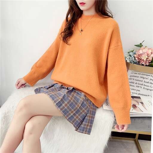 a girl in a skirt and a sweater.